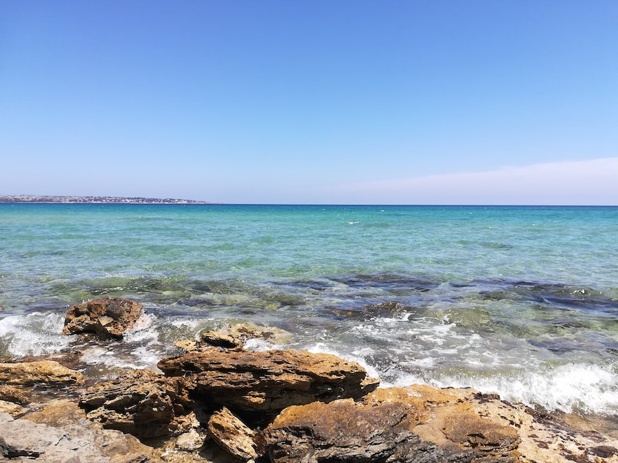 Clear sea and rocks at Arenella beach near Syracuse