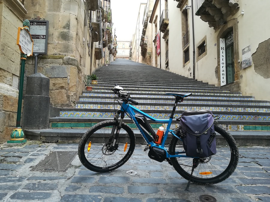 E-bike at the foot of the ceramic-tiled Scalinata di Santa Maria del Monte in Caltagirone